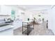 Bright kitchen seamlessly connects to the dining and living areas, fostering an inclusive atmosphere at 810 W Raleigh Ave, Statesville, NC 28677