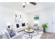 Cozy living room with modern furnishings, a stylish rug, and ample natural light streaming through the window at 810 W Raleigh Ave, Statesville, NC 28677