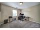 Versatile room features carpet, natural light, and is ideal for an office or guest room setup at 920 Old Forester Ln, Charlotte, NC 28214