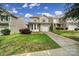 Exterior view of home with lawn, driveway and front bay window on a sunny day at 920 Old Forester Ln, Charlotte, NC 28214