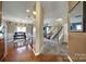 Inviting foyer with hardwood flooring, leading to the dining area, staircase, and carpeted living room at 920 Old Forester Ln, Charlotte, NC 28214