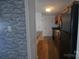 Open kitchen featuring black appliances and wood cabinets at 9501-A Shannon Green Dr, Charlotte, NC 28213