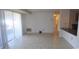 Bright living room featuring ceramic tile flooring and a walkout patio at 9501-A Shannon Green Dr, Charlotte, NC 28213