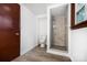 Modern, all-white bathroom with shower and new vinyl floor at 985 Needmore Rd, Woodleaf, NC 27054