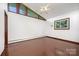 Bright bedroom with hardwood floors, a ceiling fan, and a window providing ample natural light at 985 Needmore Rd, Woodleaf, NC 27054