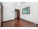 Bedroom with hardwood floors, closet, and a window bringing in natural light at 985 Needmore Rd, Woodleaf, NC 27054