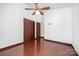 Bedroom with hardwood floors, ceiling fan, and closets providing ample space at 985 Needmore Rd, Woodleaf, NC 27054