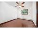 Bedroom with hardwood floors, ceiling fan, and a bright window providing plenty of natural light at 985 Needmore Rd, Woodleaf, NC 27054