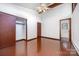 Bedroom with hardwood floors, ceiling fan, double closets and access to an ensuite bathroom at 985 Needmore Rd, Woodleaf, NC 27054