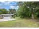 Large front yard with mature shade trees and side-entry garage at 985 Needmore Rd, Woodleaf, NC 27054