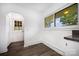 Cozy kitchen nook with white walls, laminate floors and natural light at 985 Needmore Rd, Woodleaf, NC 27054