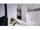 Modern bathroom with tiled shower, toilet, and a vanity with decoratives on the counter top at 0 Mineral Ln, Lincolnton, NC 28092