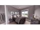 Well-lit bedroom showcasing a queen-sized bed, with closet and dresser for storage at 0 Mineral Ln, Lincolnton, NC 28092