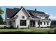 Inviting home featuring a covered porch, complemented by landscaped garden and lush green lawn at 0 Mineral Ln, Lincolnton, NC 28092