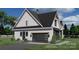 A modern home featuring a clean, minimalistic design with a sleek garage door and tidy landscaping at 0 Mineral Ln, Lincolnton, NC 28092