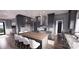 An elegant kitchen features gray cabinetry, a center island with seating, and modern lighting at 0 Mineral Ln, Lincolnton, NC 28092