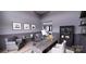 A modern office space with a desk, two chairs, custom shelving, and decorative artwork at 0 Mineral Ln, Lincolnton, NC 28092