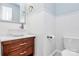 Charming half-bathroom with a stylish vessel sink, wood vanity, and white wainscoting at 1011 Bydeford Ct, Matthews, NC 28105
