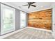 Bright bedroom boasts hardwood accent wall and large windows at 1011 Bydeford Ct, Matthews, NC 28105