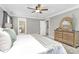 This primary bedroom boasts great natural light, neutral décor, and ensuite bath access at 1011 Bydeford Ct, Matthews, NC 28105