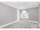 A bright room with a neutral color pallet and a decorative window at 1011 Bydeford Ct, Matthews, NC 28105