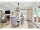 Bright dining room with coffered ceilings, and a view into the living room at 1011 Bydeford Ct, Matthews, NC 28105