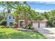 Charming two-story home with a brick facade, attached two-car garage, and a well-maintained lawn at 1011 Bydeford Ct, Matthews, NC 28105