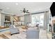 Cozy living room with a fireplace, neutral walls, and lots of natural light at 1011 Bydeford Ct, Matthews, NC 28105