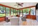 Relaxing screened porch features ceiling fan and comfortable seating at 1011 Bydeford Ct, Matthews, NC 28105