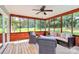 Relaxing screened porch features ceiling fan and comfortable seating at 1011 Bydeford Ct, Matthews, NC 28105