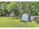 Charming shed with painted doors and landscaping in a spacious backyard at 1011 Bydeford Ct, Matthews, NC 28105