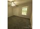 Neutral bedroom with carpet, closet with doors and window providing natural light at 109 Phil Ct, Fort Mill, SC 29715