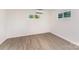 This bedroom has two windows, wood-look floors, neutral paint and natural light at 112 Lineberger St, Stanley, NC 28164