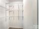 Walk-in closet features abundant shelving for clothing and storage at 112 Lineberger St, Stanley, NC 28164