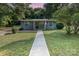 Charming single-story home boasts a freshly painted exterior, manicured lawn and inviting walkway at 112 Lineberger St, Stanley, NC 28164