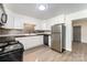 Modern kitchen featuring stainless steel appliances, white cabinets, and stylish backsplash at 112 Lineberger St, Stanley, NC 28164