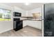Modern kitchen featuring stainless steel appliances, white cabinets, and stylish backsplash at 112 Lineberger St, Stanley, NC 28164