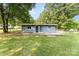 Single-story home featuring a fenced yard and patio, perfect for enjoying outdoor living at 112 Lineberger St, Stanley, NC 28164