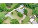 Spacious property featuring a home with a pool, lush greenery, and detached garage at 115 Turner St, Lincolnton, NC 28092