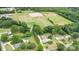 Aerial view of a home with pool, near park, baseball fields, and parking at 115 Turner St, Lincolnton, NC 28092