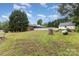 Spacious backyard with fenced pool, mature trees, landscaping and detached garage at 115 Turner St, Lincolnton, NC 28092