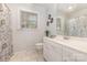 Neutral bathroom with a white vanity cabinet, floral shower curtain, and large window at 115 Turner St, Lincolnton, NC 28092