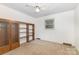 Bedroom featuring wood-style wall unit and a window that provides natural light at 115 Turner St, Lincolnton, NC 28092