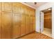 Bedroom features multiple closets with wood-finished doors and hardwood floors at 115 Turner St, Lincolnton, NC 28092