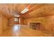 A wood-paneled room has a table, chair, and hardwood floor at 115 Turner St, Lincolnton, NC 28092