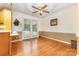Bright dining area features hardwood floors, a ceiling fan, and direct access to the backyard at 115 Turner St, Lincolnton, NC 28092