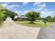 Charming brick ranch home with long driveway, detached garage, and a well-manicured front lawn at 115 Turner St, Lincolnton, NC 28092