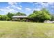 Charming brick ranch home featuring a well-manicured lawn and mature trees for added privacy at 115 Turner St, Lincolnton, NC 28092