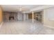 Expansive living room featuring a brick fireplace and tile flooring at 115 Turner St, Lincolnton, NC 28092