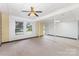 Bright room with large windows and carpet at 115 Turner St, Lincolnton, NC 28092